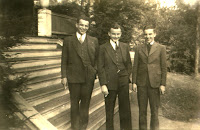 A group of men standing on stairs

Description automatically generated